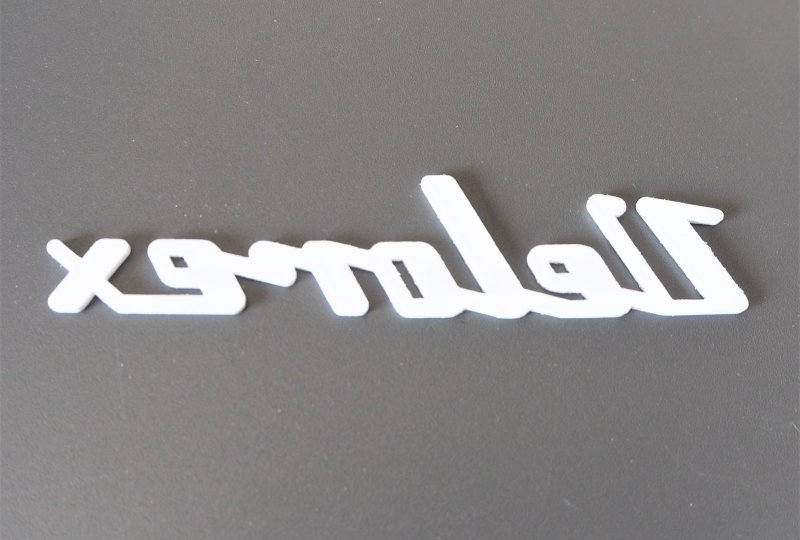 Emblemat VELOREX, plastik, biały-photo1